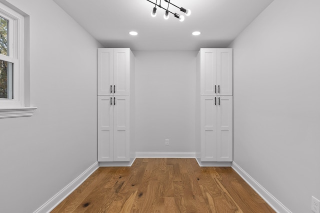 hallway featuring hardwood / wood-style flooring