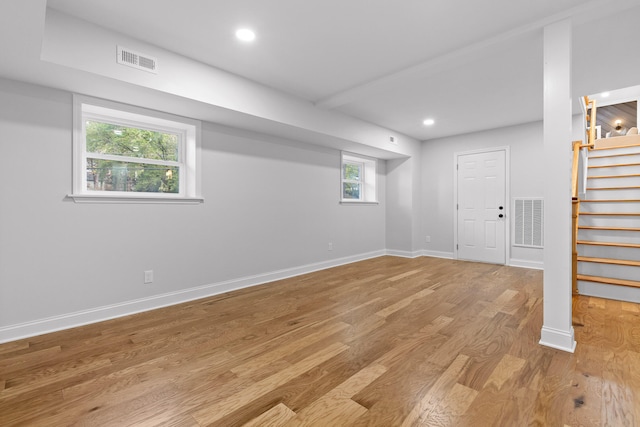 basement featuring light hardwood / wood-style floors