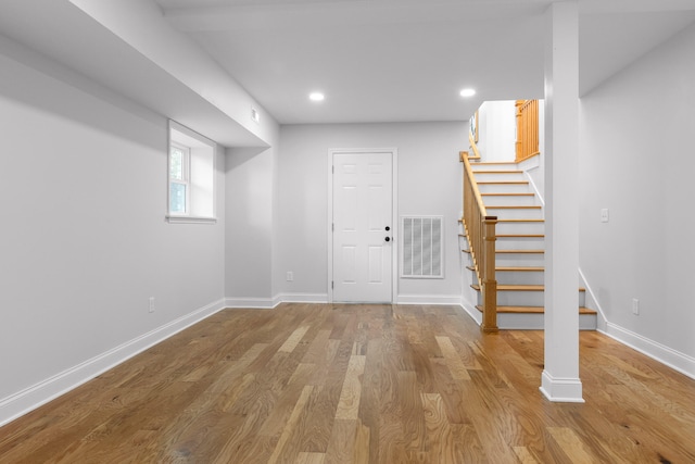 basement featuring wood-type flooring