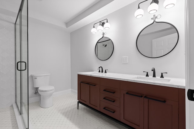 bathroom featuring toilet, vanity, tile patterned floors, and a shower with shower door