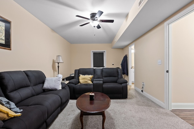 living room featuring hardwood / wood-style flooring and ceiling fan