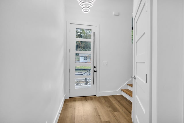 doorway to outside with light hardwood / wood-style flooring