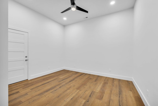 empty room with wood-type flooring and ceiling fan