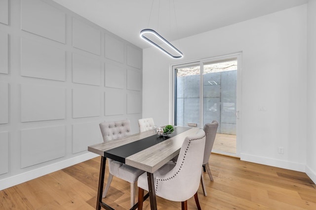 dining space featuring light hardwood / wood-style flooring