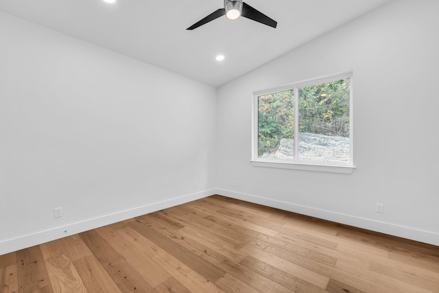 unfurnished room featuring hardwood / wood-style floors, ceiling fan, and lofted ceiling