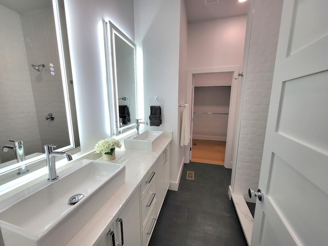 bathroom featuring tile patterned flooring and vanity