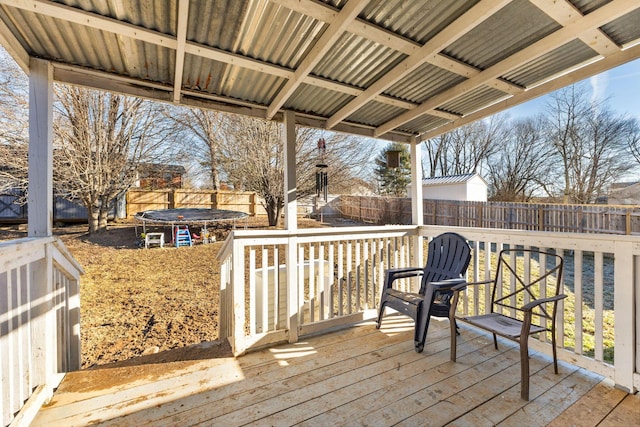 wooden deck with a trampoline