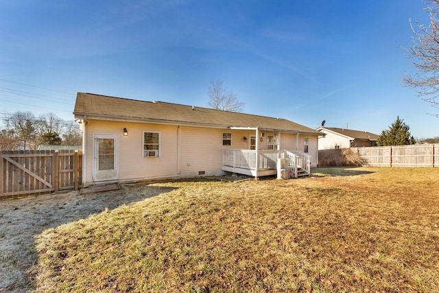 back of property featuring a yard and a deck