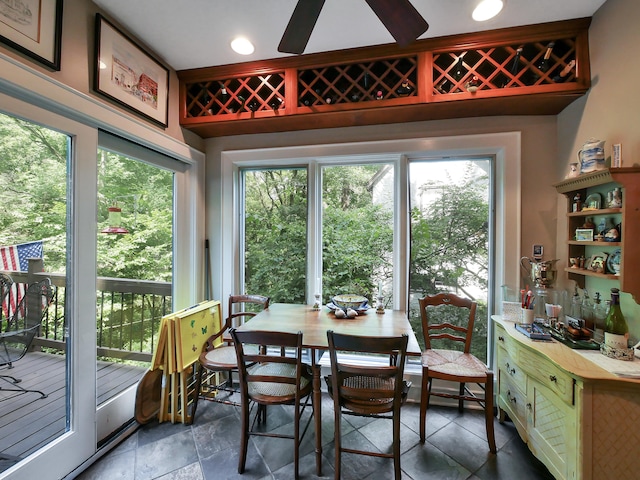 dining area with plenty of natural light and ceiling fan