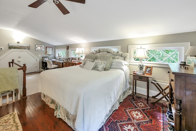 bedroom with ceiling fan, dark hardwood / wood-style floors, and vaulted ceiling