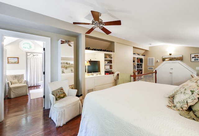 bedroom featuring ceiling fan, dark hardwood / wood-style floors, multiple windows, and lofted ceiling