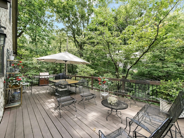 wooden deck with a grill