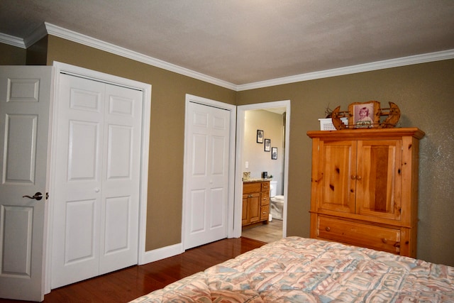 bedroom with hardwood / wood-style floors, connected bathroom, and ornamental molding