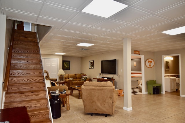 334 Belaire Dr, Copperhill, TN 37317 - living room with light tile patterned floors, stairs, and baseboards