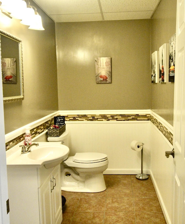 334 Belaire Dr, Copperhill, TN 37317 - bathroom with toilet, vanity, tile patterned flooring, and a drop ceiling