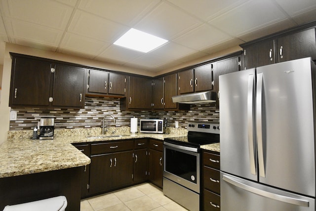 334 Belaire Dr, Copperhill, TN 37317 - kitchen featuring stainless steel appliances, a sink, under cabinet range hood, and decorative backsplash