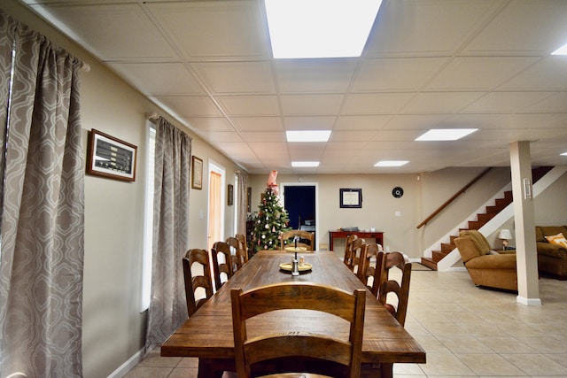 334 Belaire Dr, Copperhill, TN 37317 - dining space with light tile patterned flooring, stairs, and baseboards