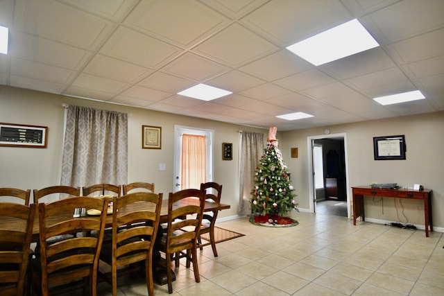 334 Belaire Dr, Copperhill, TN 37317 - dining room with light tile patterned flooring, a drop ceiling, and baseboards