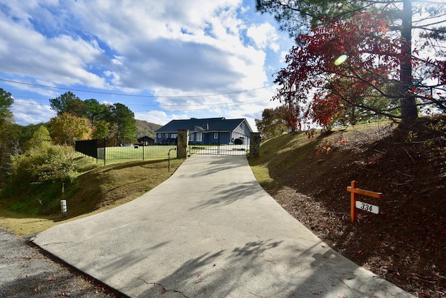 334 Belaire Dr, Copperhill, TN 37317 - view of concrete surface with a gated entry and a gate