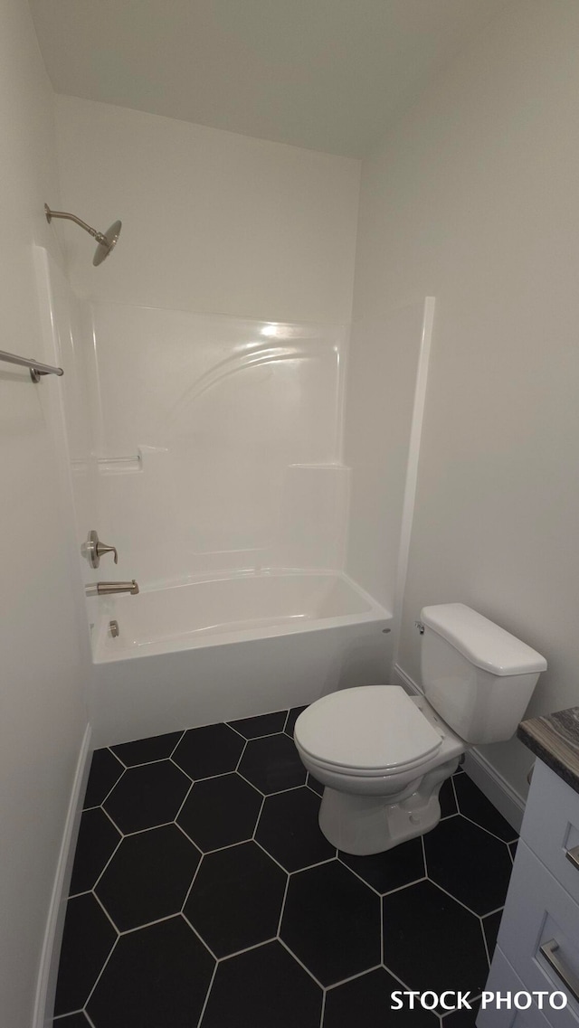 full bathroom with toilet, shower / washtub combination, tile patterned floors, and vanity