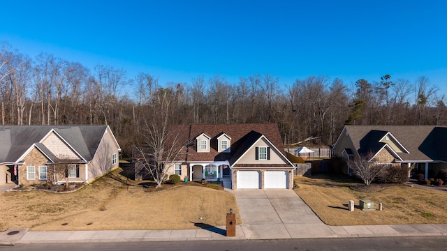 view of front of home with a garage and a front yard