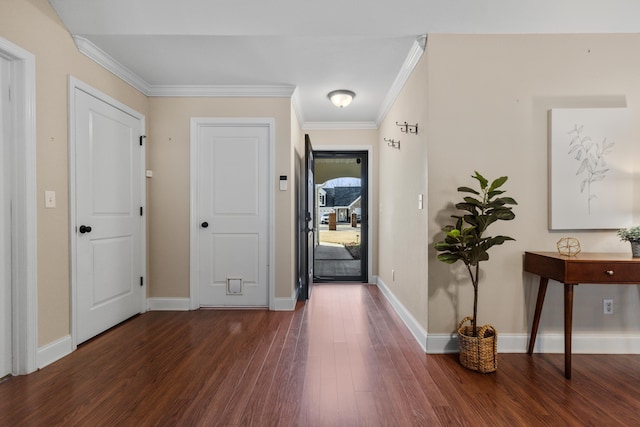 entryway with dark wood-type flooring and ornamental molding