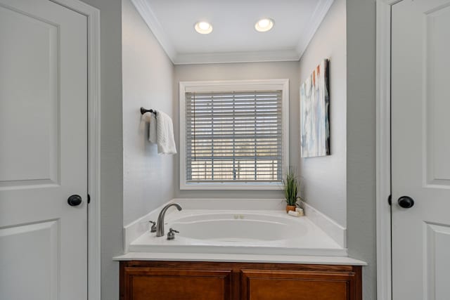 bathroom featuring a bath and ornamental molding