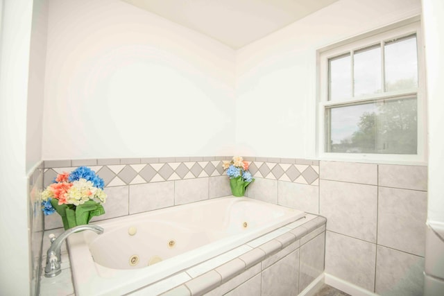 bathroom with tiled tub