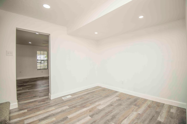 unfurnished room featuring wood-type flooring