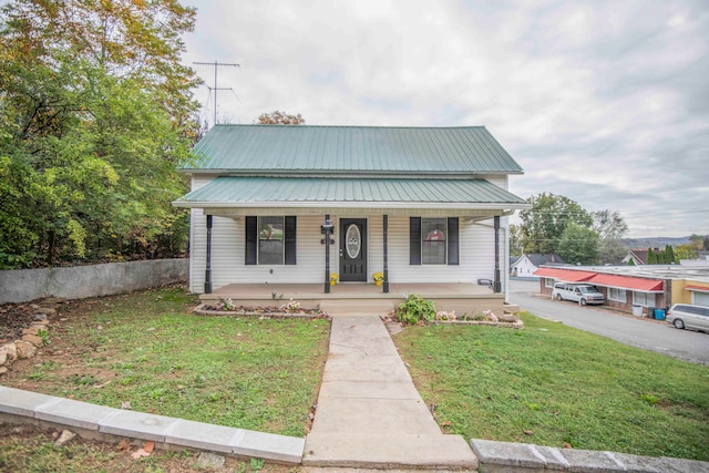 bungalow featuring a front yard and a porch