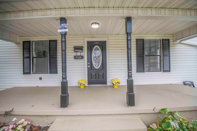 doorway to property with a porch