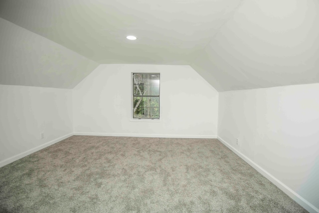 bonus room featuring carpet floors and lofted ceiling