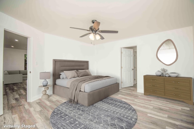 bedroom featuring ceiling fan and light hardwood / wood-style flooring