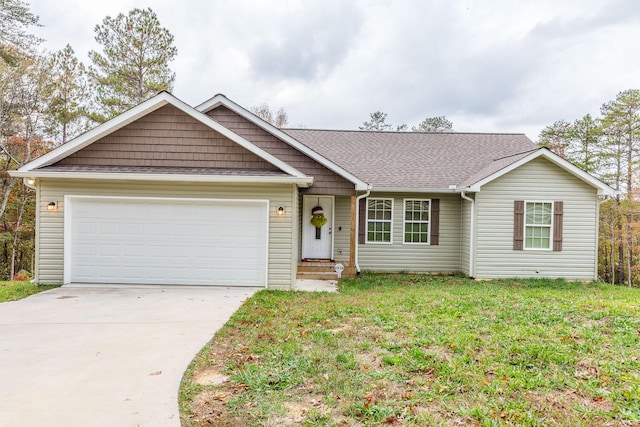 ranch-style home with a garage and a front lawn