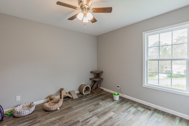 empty room featuring hardwood / wood-style floors and ceiling fan