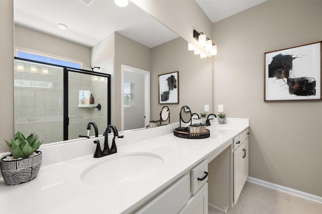 bathroom with vanity, tile patterned flooring, a shower with door, and plenty of natural light