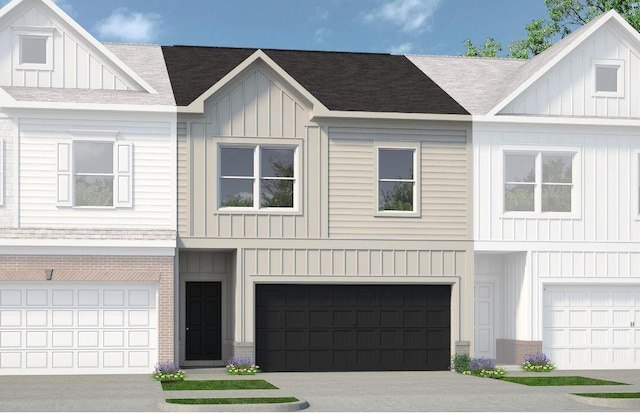 townhome / multi-family property with a garage