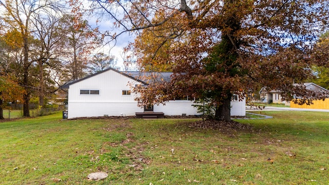 view of property exterior featuring a yard