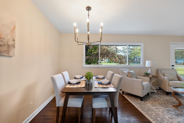 dining space featuring a chandelier, dark hardwood / wood-style flooring, and a wealth of natural light