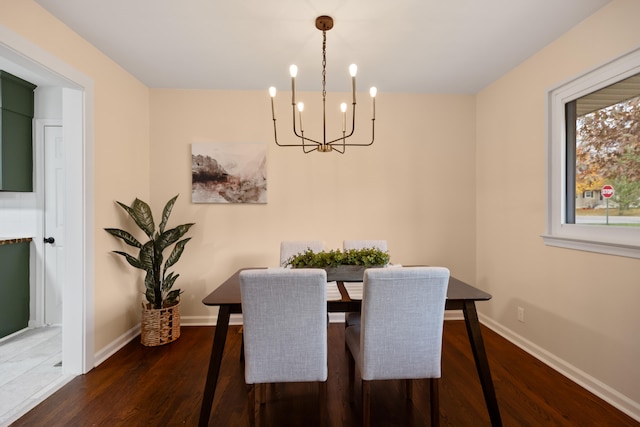 dining room featuring a chandelier and dark hardwood / wood-style floors