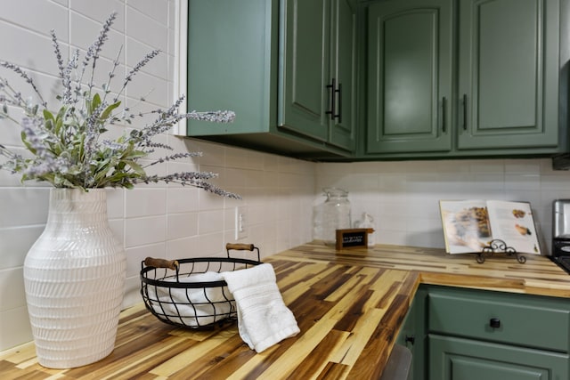 kitchen with wood-type flooring, green cabinetry, and wood counters