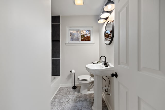 bathroom with tile patterned floors, tub / shower combination, and toilet