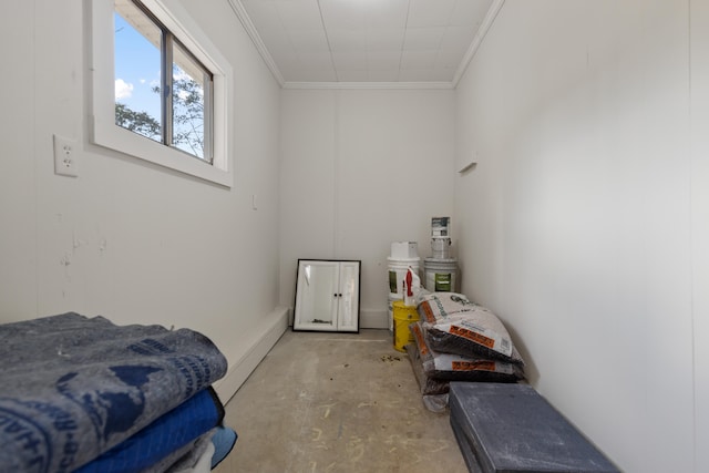 bedroom with crown molding and a baseboard heating unit