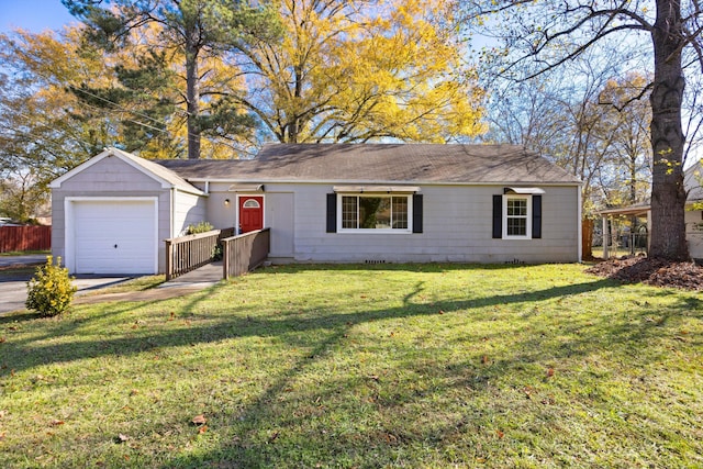 ranch-style home with a front yard and a garage