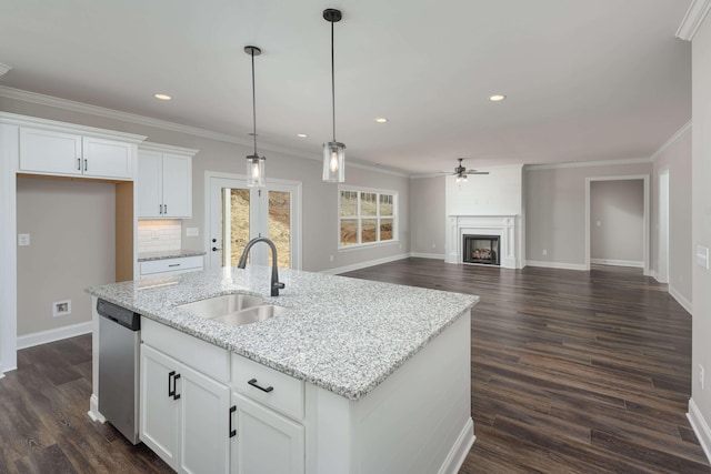 kitchen with dishwasher, white cabinetry, sink, and dark hardwood / wood-style floors