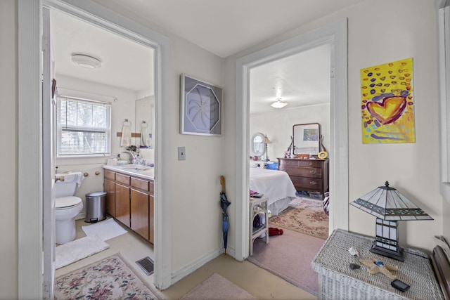 bathroom with vanity and toilet