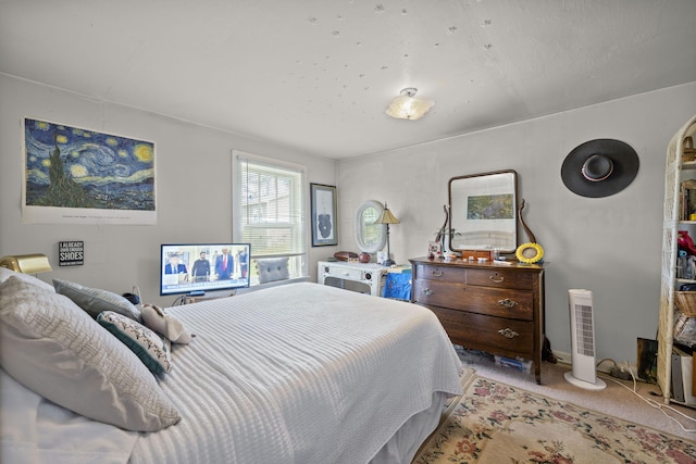 bedroom featuring light carpet