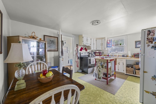 view of carpeted dining space