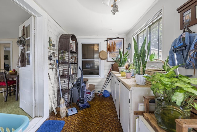 interior space featuring wooden counters and wooden walls