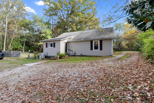 rear view of house with central AC